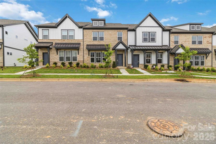 Front exterior of a new home in Ridge at Sugar Creek, Indian Land, SC, highlighting curb appeal (Image 23). Front exterior of a new home in Ridge at Sugar Creek, Indian Land, SC, highlighting curb appeal (Image 23).