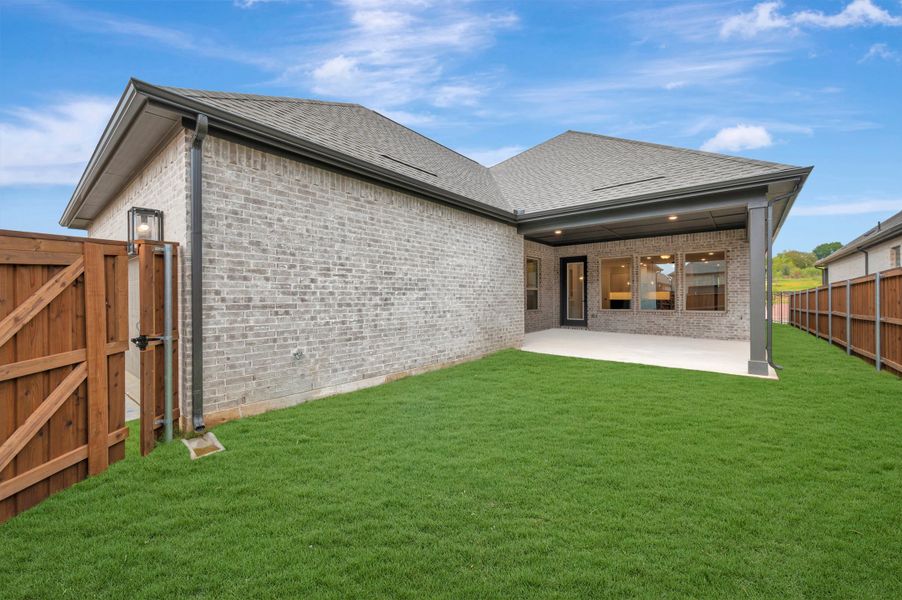 Exterior details and patio area of a home in Elements at Viridian - Traditional Series, Arlington (Image 3).