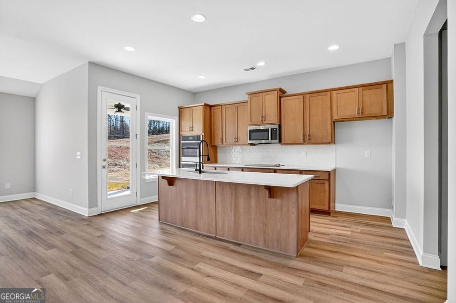 Furnished interior view inside a new home in Stone Brooke, Gray (Image 7).