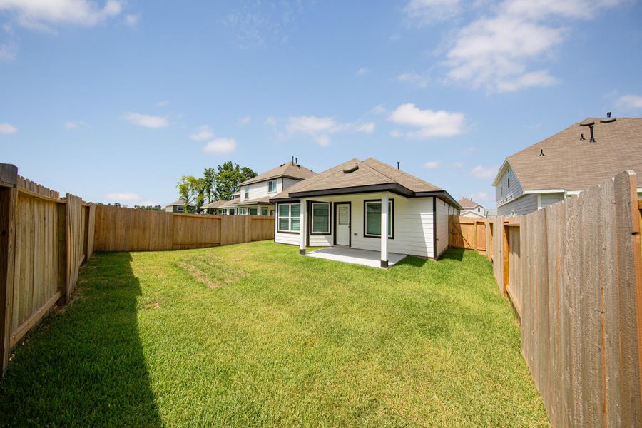Front exterior of a new home in Ridgeland Hills, Willis, TX, highlighting curb appeal (Image 2).