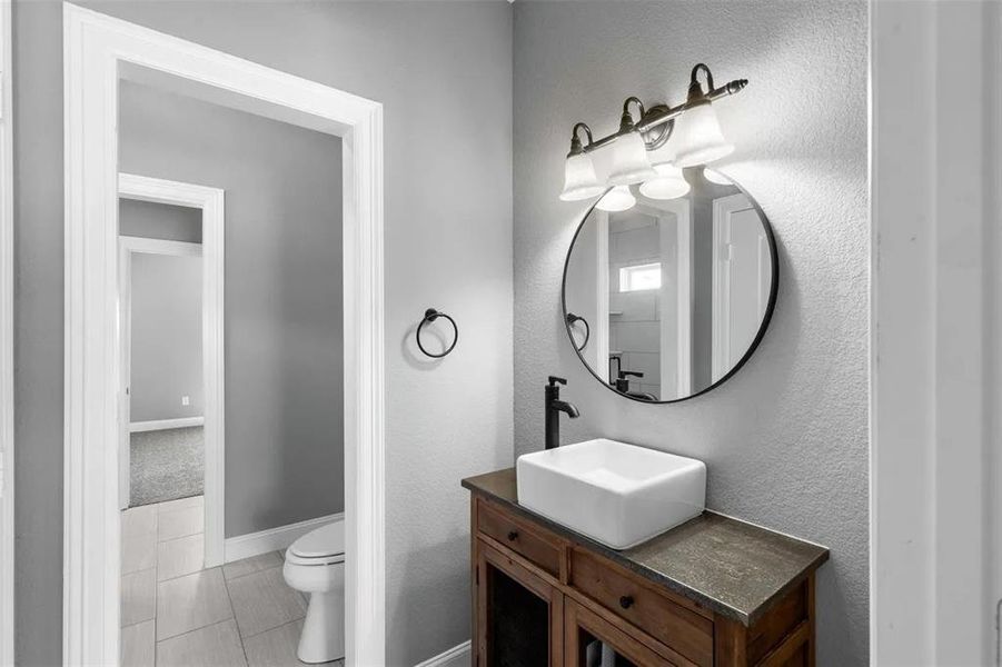 Bathroom with vanity and baseboards