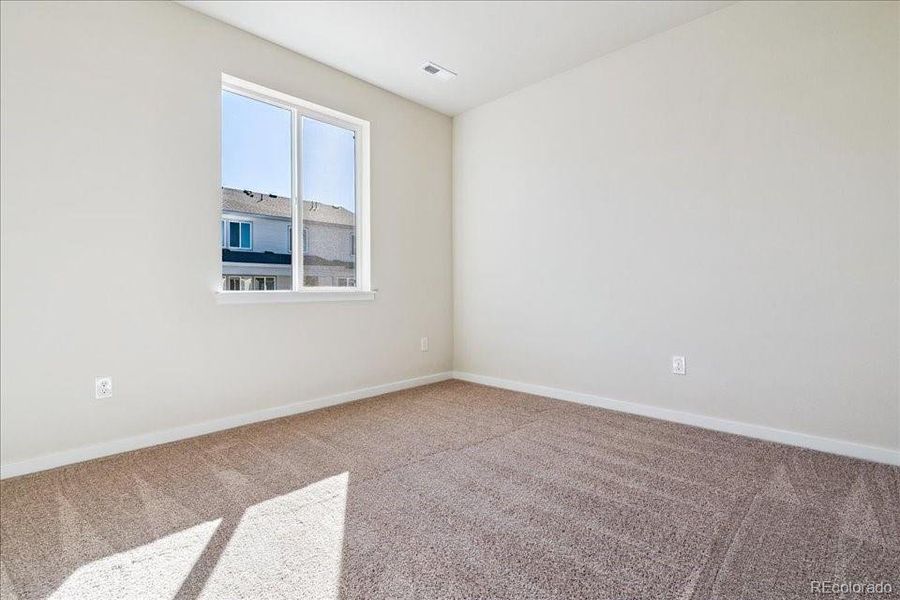 Spacious, unfurnished interior of a new home in Floret Collection at Alder Creek, Parker (Image 27).