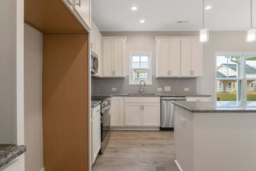 Representative furnished interior of a home built from the Magnolia by Caviness & Cates Communities in Bartlett Manor, Youngsville (Image 36).