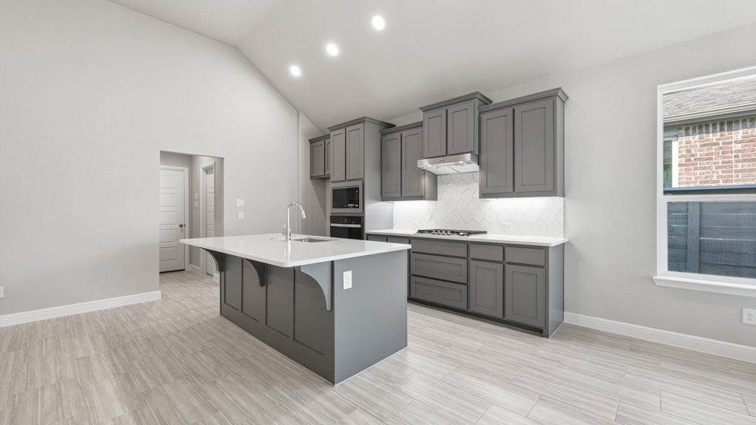 Representative furnished interior of a home built from the BASSWOOD by D.R. Horton in Treeline, Justin (Image 10).