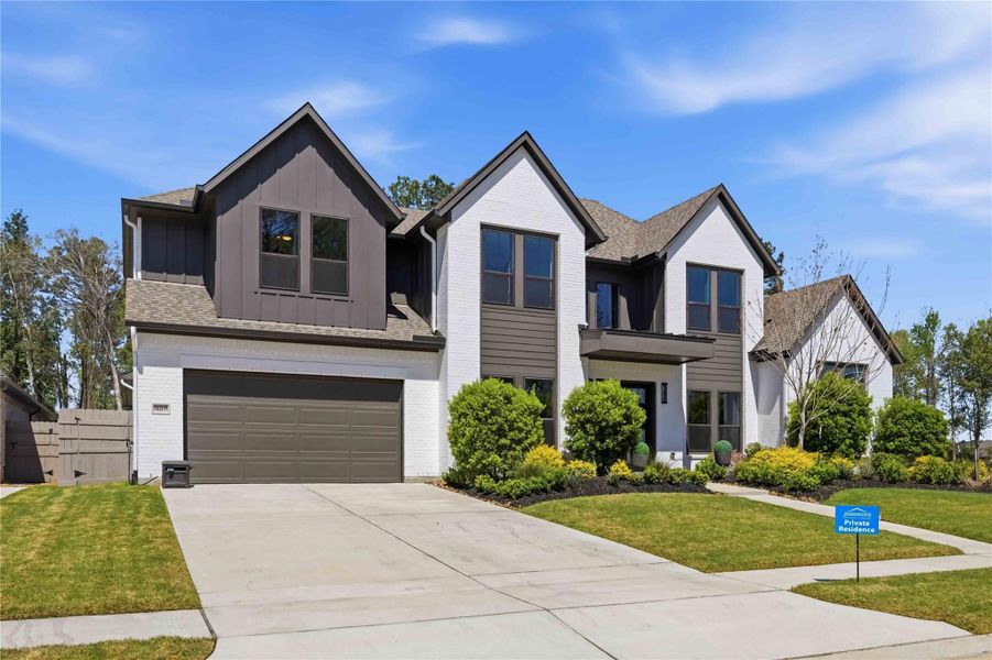 Front exterior of a new home in Artavia, Conroe, TX, highlighting curb appeal (Image 21).