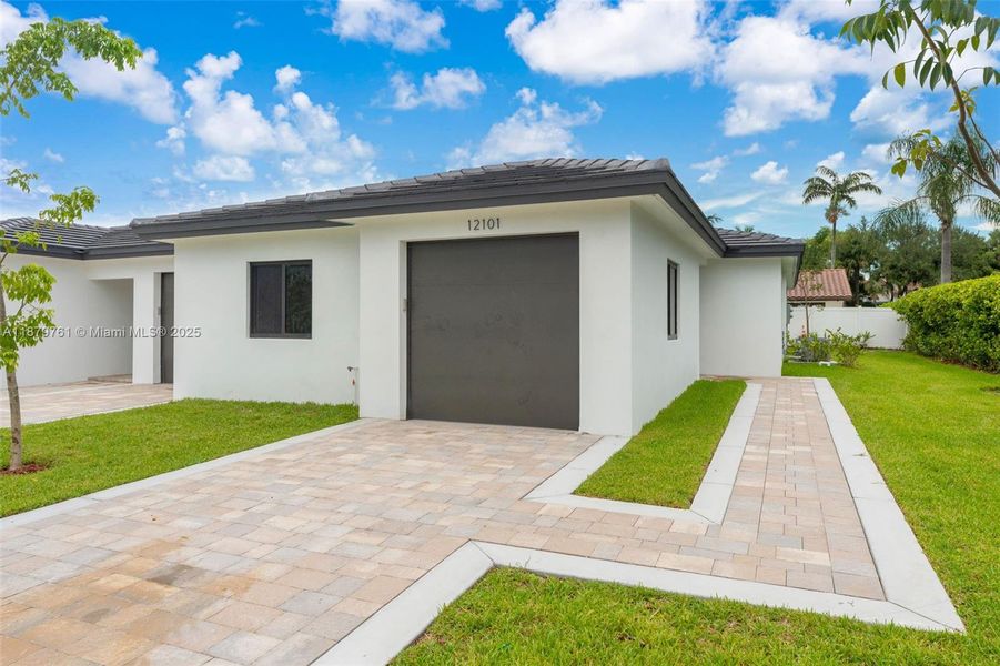 Front exterior of a new home in , Miami, FL, highlighting curb appeal (Image 21). Front exterior of a new home in , Miami, FL, highlighting curb appeal (Image 21).