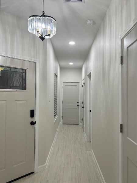 Entry hallway to bedroom 3 and to garage