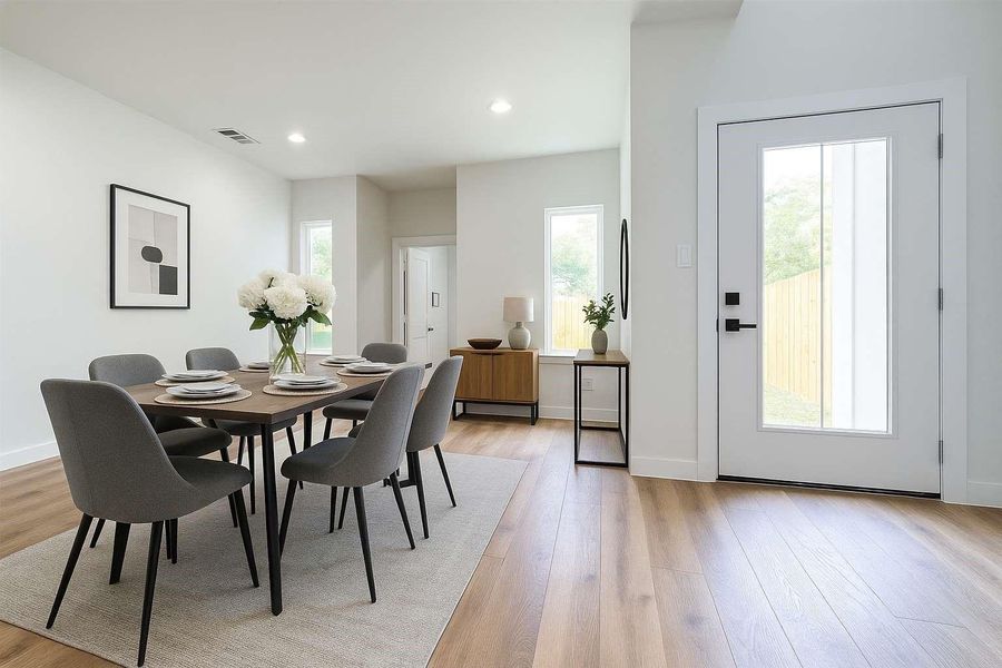 Dining room, half bathroom and door to backyard. Virtually staged.