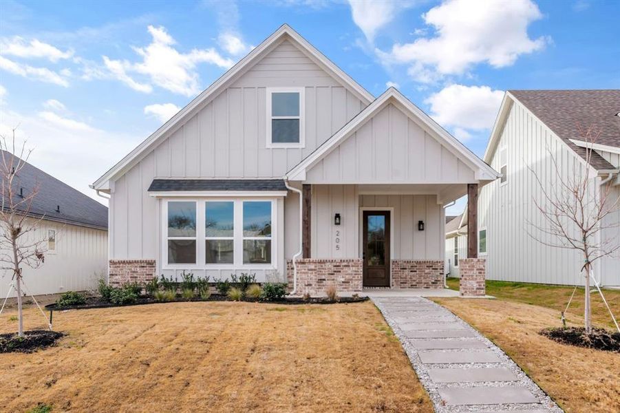 Front exterior of a new home in , Justin, TX, highlighting curb appeal (Image 17). Front exterior of a new home in , Justin, TX, highlighting curb appeal (Image 17).