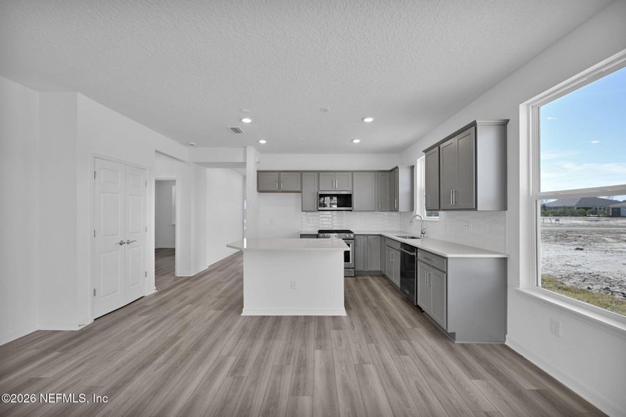 Furnished interior view inside a new home in Del Webb Wildlight, Yulee (Image 7).