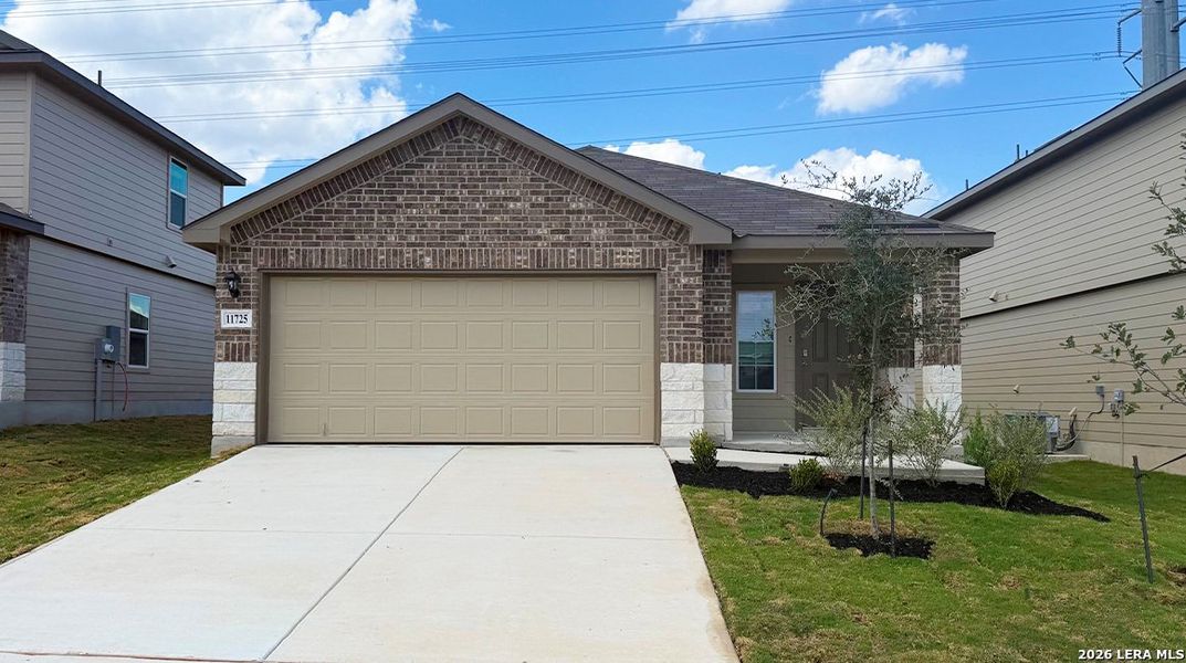 Front exterior of a new home in Laurel Vistas, San Antonio, TX, highlighting curb appeal (Image 2). Front exterior of a new home in Laurel Vistas, San Antonio, TX, highlighting curb appeal (Image 2).