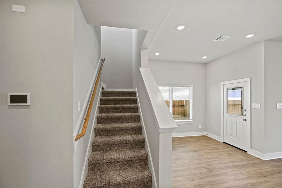 Upstairs to the bedrooms and additional flex space.