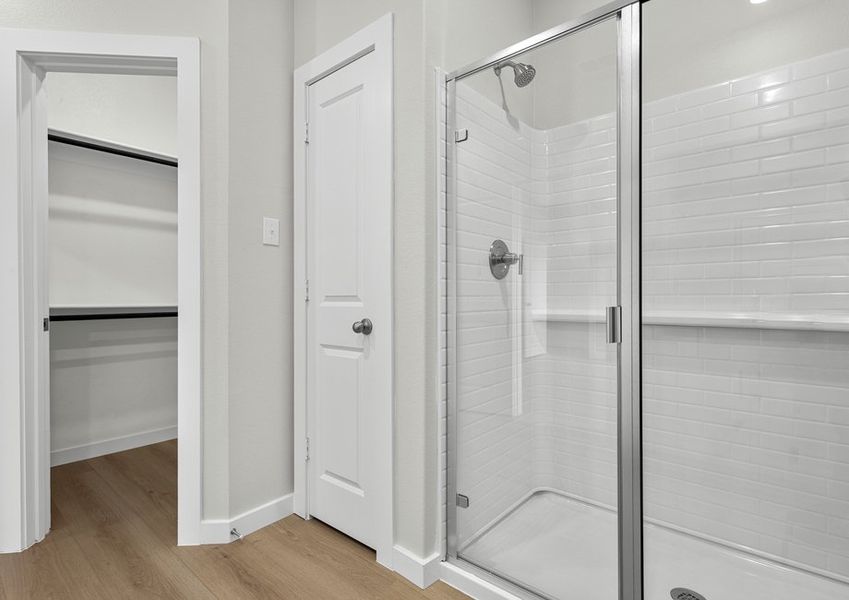 Master bath has a shower, linen closet, and walk-in closet.