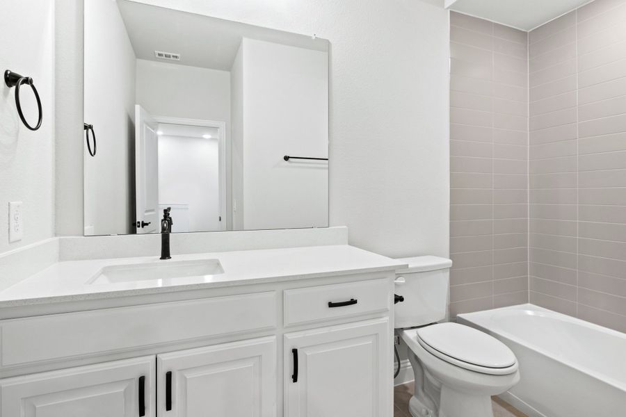 Furnished interior view inside a new home in The Tribute, The Colony (Image 19).