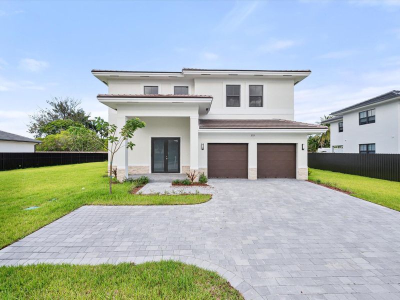 Front exterior of a new home in , Miami, FL, highlighting curb appeal (Image 22).