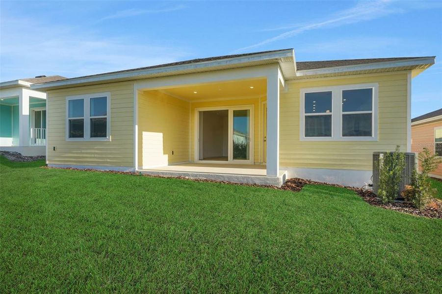Exterior details and patio area of a home in Green Key Village, Lady Lake (Image 21).