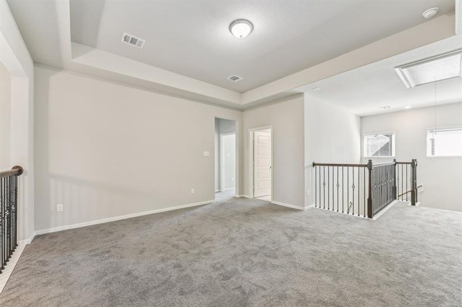 Discover the endless possibilities of this spacious upstairs area. Perfect for a game room, media room, or play area.