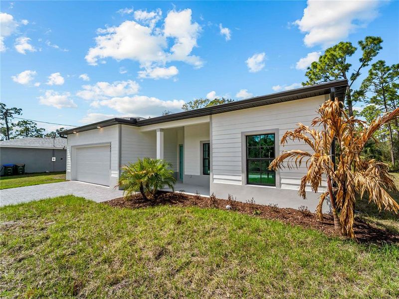 Exterior details and patio area of a home in , North Port (Image 37).