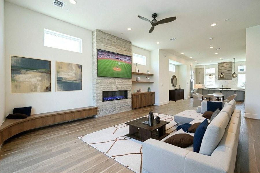 Open Living Area with Fireplace, and Niche for Large Screen TV. Large Size White Oak Floors. Lots of Natural Light. 10' Ceilings. Virtually Staged.