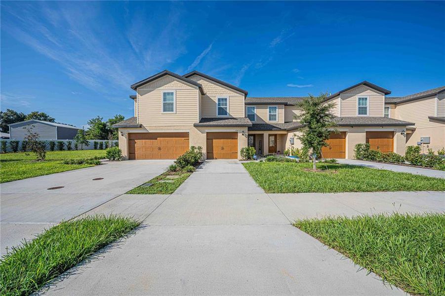 Front exterior of a new home in Hamlets of Tavares, Tavares, FL, highlighting curb appeal (Image 21). Front exterior of a new home in Hamlets of Tavares, Tavares, FL, highlighting curb appeal (Image 21).
