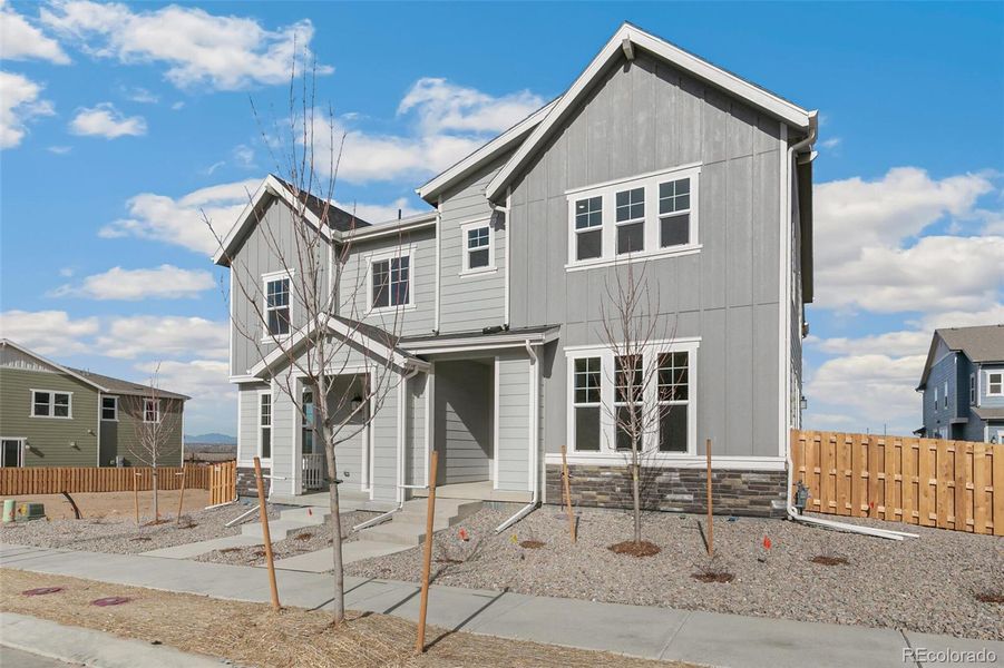 Front exterior of a new home in Turnberry Villas, Commerce City, CO, highlighting curb appeal (Image 25).