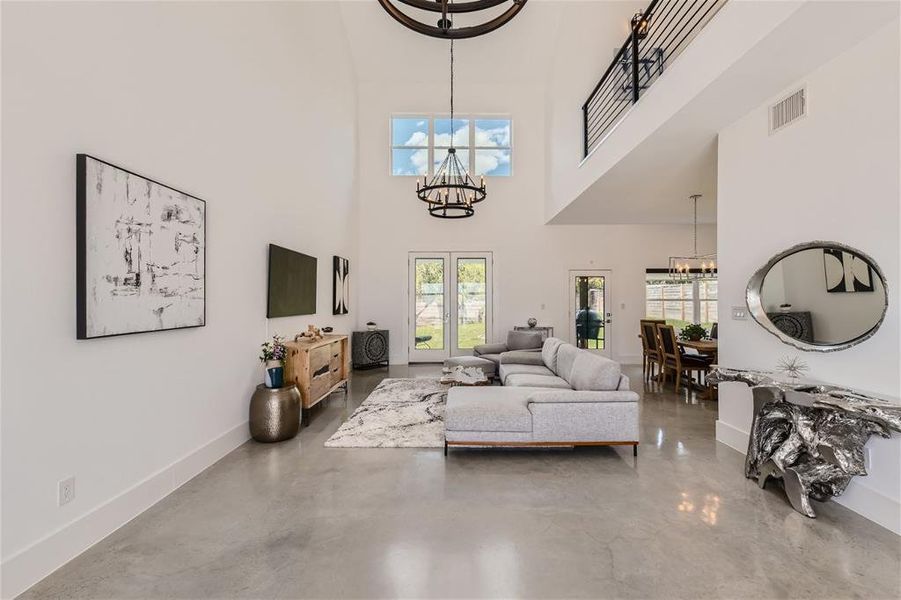 Super high ceilings, low maintenance flooring for this open concept floorplan.