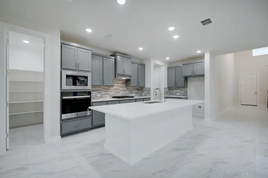 Representative furnished interior of a home built from the Travis by Scott Felder Homes in Flora, Hutto (Image 8).