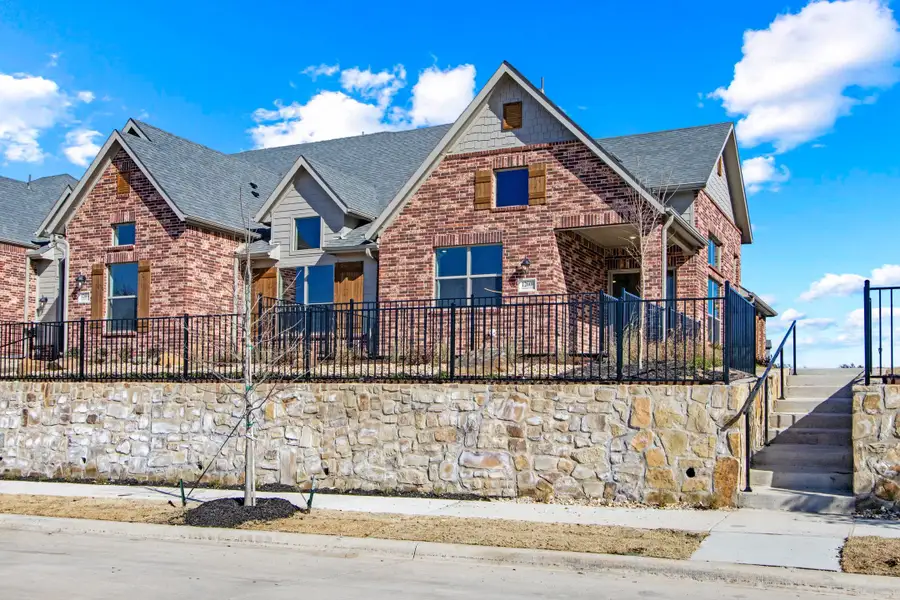 Front exterior of a new home in Cottonwood Creek, Rowlett, TX, highlighting curb appeal (Image 2). Front exterior of a new home in Cottonwood Creek, Rowlett, TX, highlighting curb appeal (Image 2).