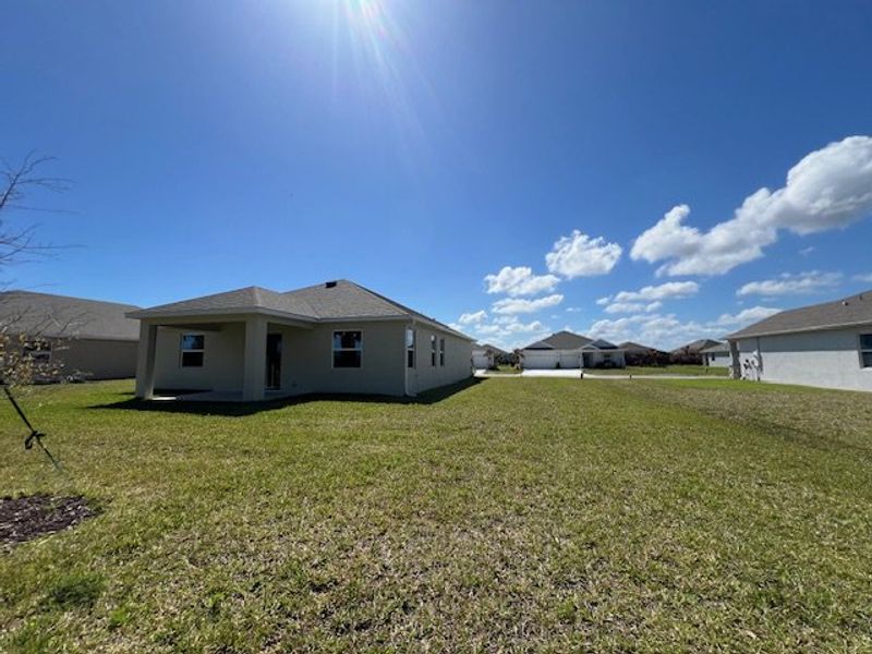 Exterior details and patio area of a home in Lakes At St Sebastian, Micco (Image 21).