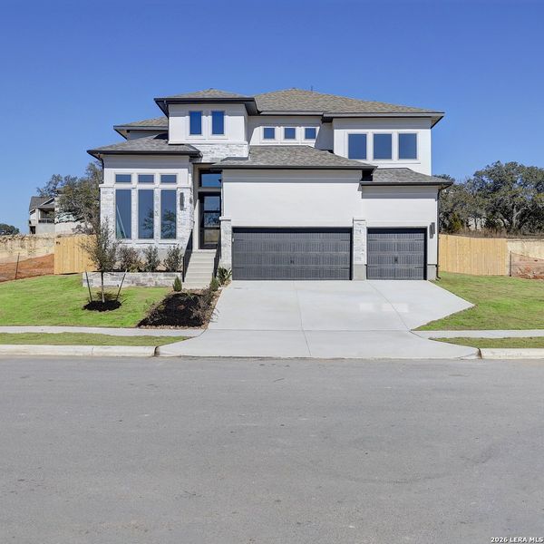 Front exterior of a new home in The Ranches at Creekside, Boerne, TX, highlighting curb appeal (Image 2).