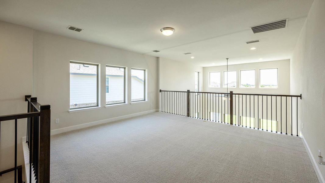 Unfurnished room featuring plenty of natural light, carpet floors, and recessed lighting