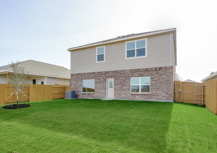 The back yard is fully fenced in.