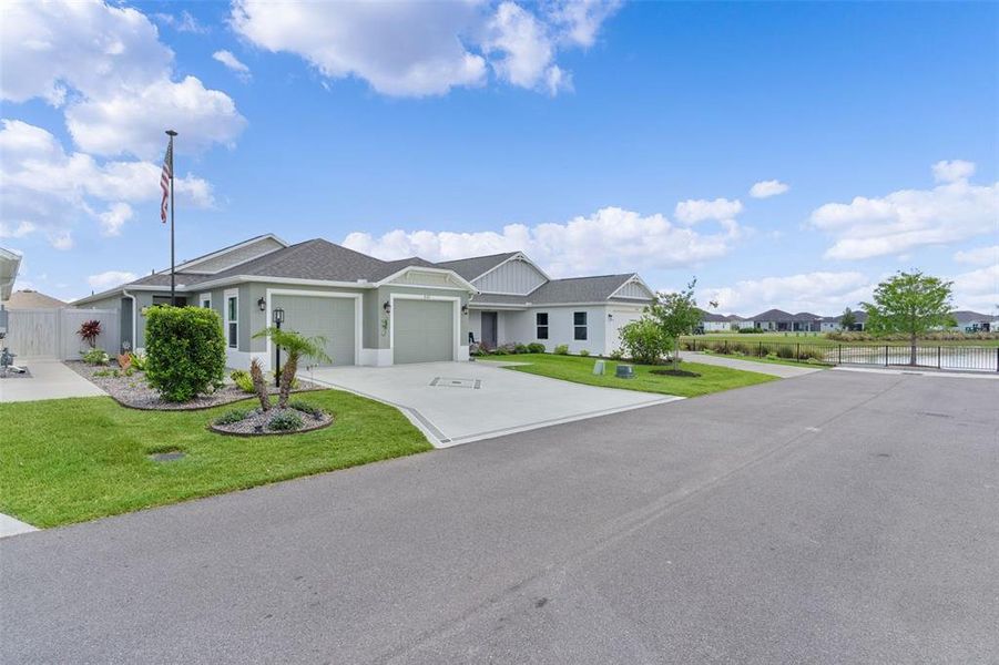 Front exterior of a new home in , The Villages, FL, highlighting curb appeal (Image 23).