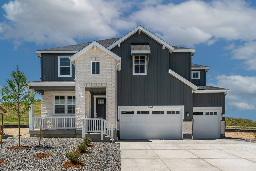 Representative exterior photo of a completed home built from the Vail by Taylor Morrison in Hillside at Crystal Valley Destination Collection, Castle Rock, CO (Image 1).
