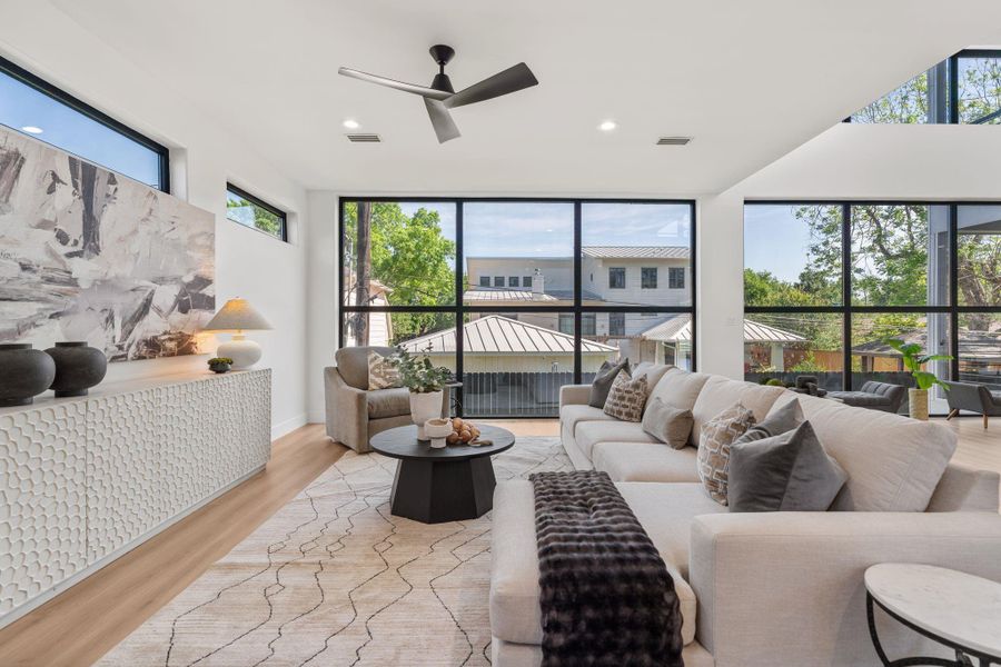 Stunning outdoor views are visible from any angle in this captivating first floor living space.