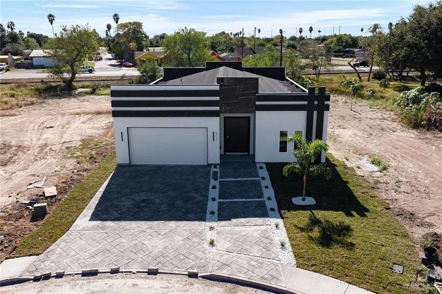 Front exterior of a new home in , Donna, TX, highlighting curb appeal (Image 2). Front exterior of a new home in , Donna, TX, highlighting curb appeal (Image 2).