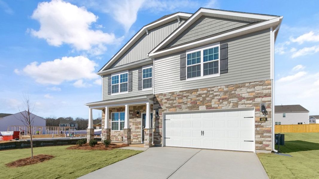 Front exterior of a new home in Ridgewood Farms, Winterville, NC, highlighting curb appeal (Image 19).