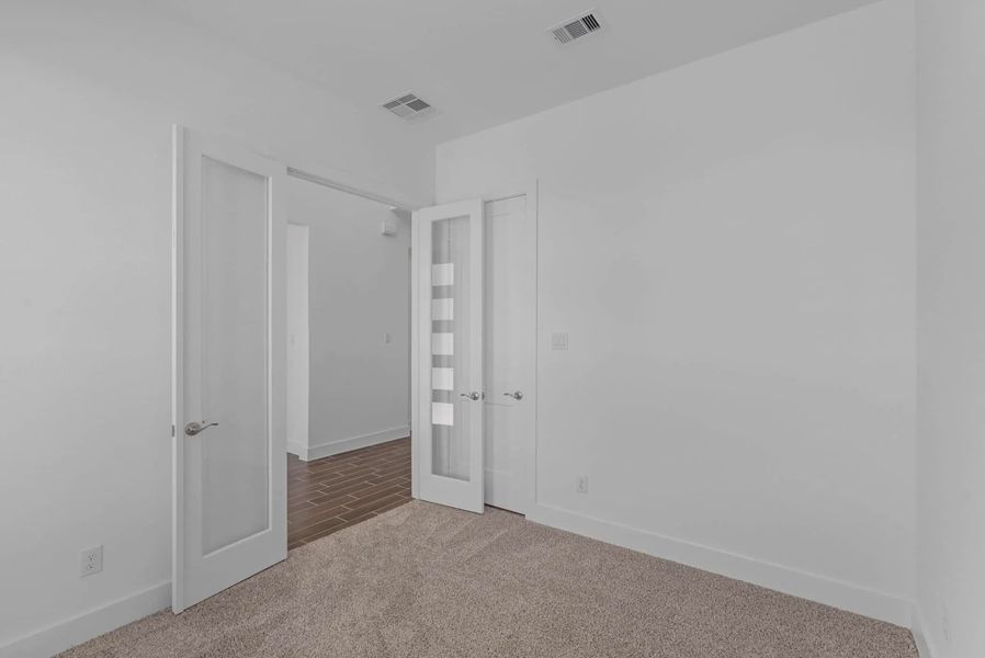 Representative unfurnished interior of a home built from the St Andrews by Chesmar Homes in Riceland Alley Loads, Mont Belvieu (Image 41).