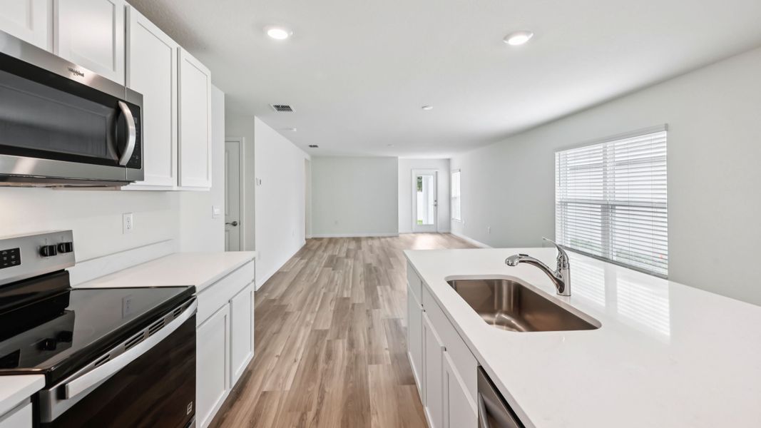 Representative furnished interior of a home built from the HARPER by D.R. Horton in Sherman Oaks, Brooksville (Image 15).
