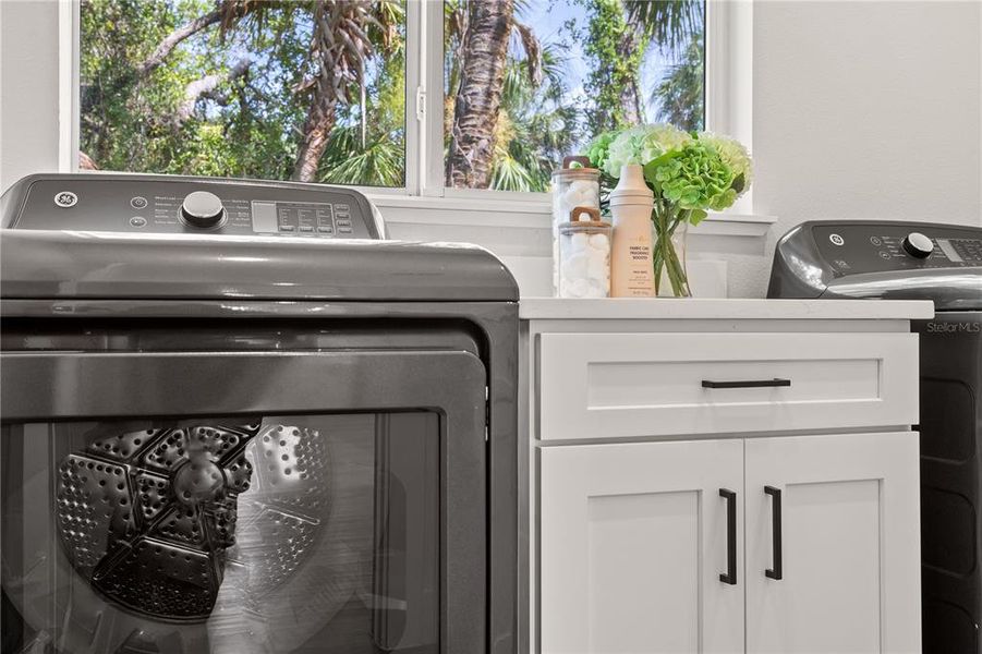 Walk in Laundry with Built in Sink Cabinetry and Washer / Dryer Walk in Laundry with Built in Sink Cabinetry and Washer / Dryer