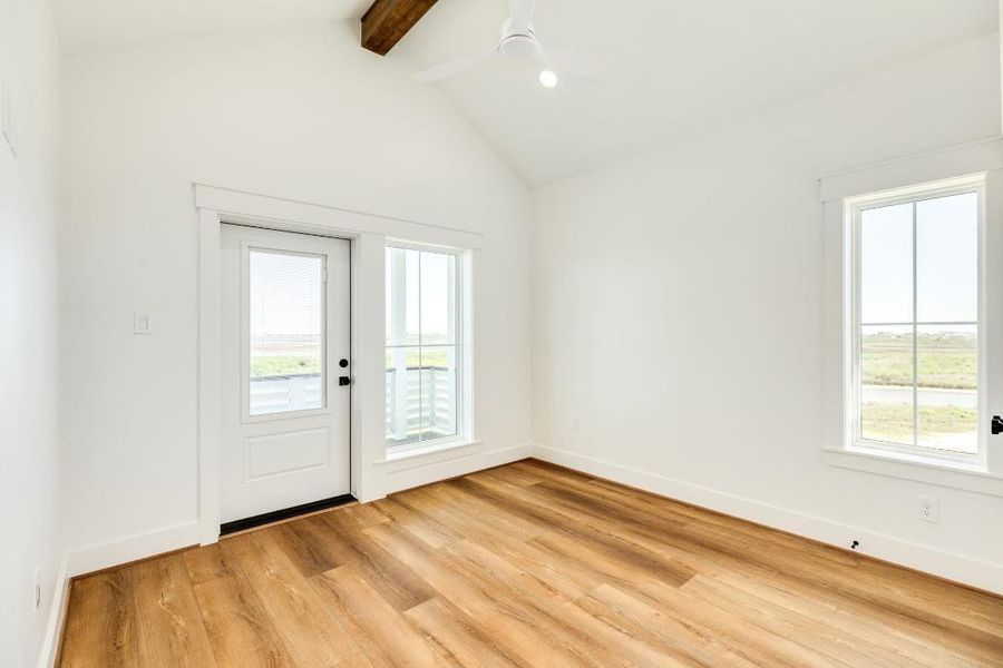 Upstairs bedroom with balcony & water views