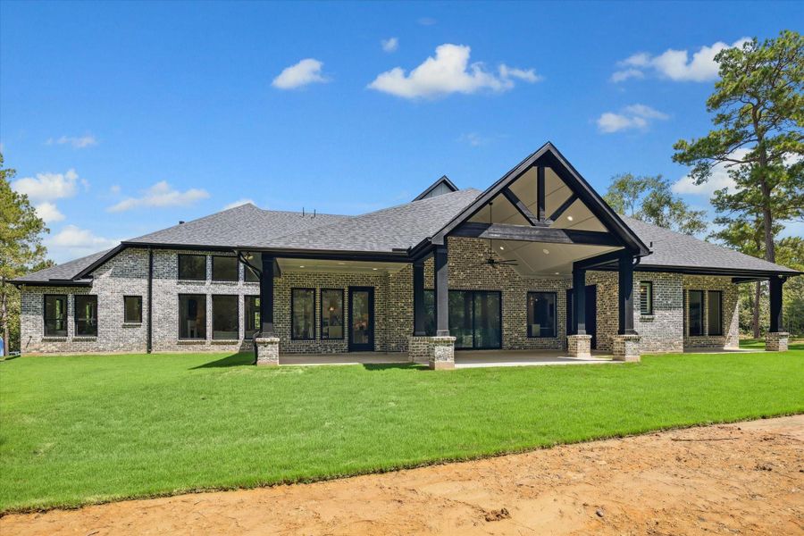 Exterior real elevation showcasing stunning back patio