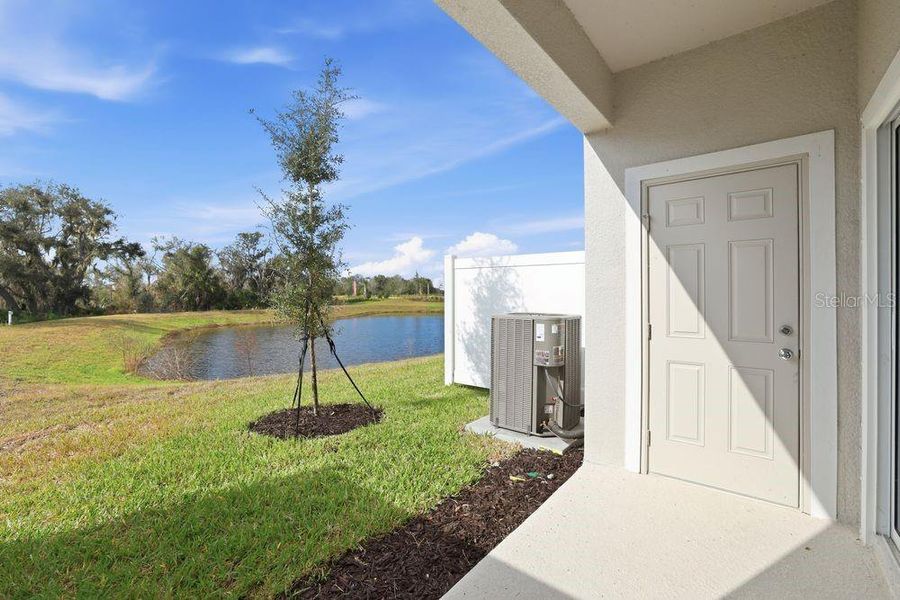 Exterior details and patio area of a home in The Towns at Firethorn, Parrish (Image 4).