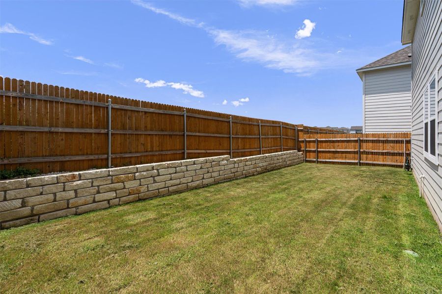 View of fenced backyard