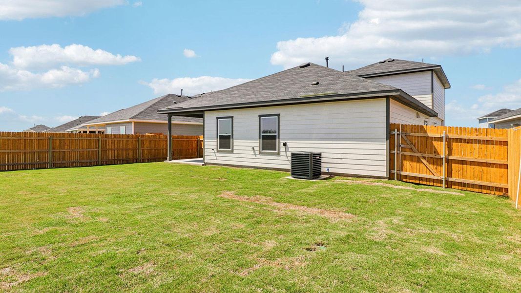 Exterior details and patio area of a home in Monarch Ranch, Manor (Image 18).