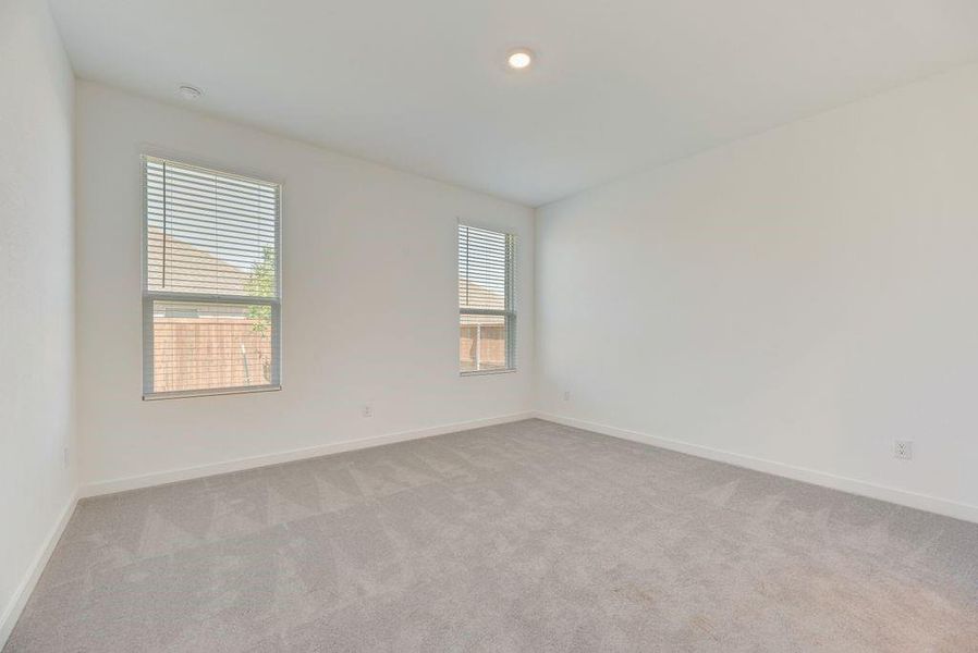 Unfurnished room featuring carpet flooring and baseboards Unfurnished room featuring carpet flooring and baseboards