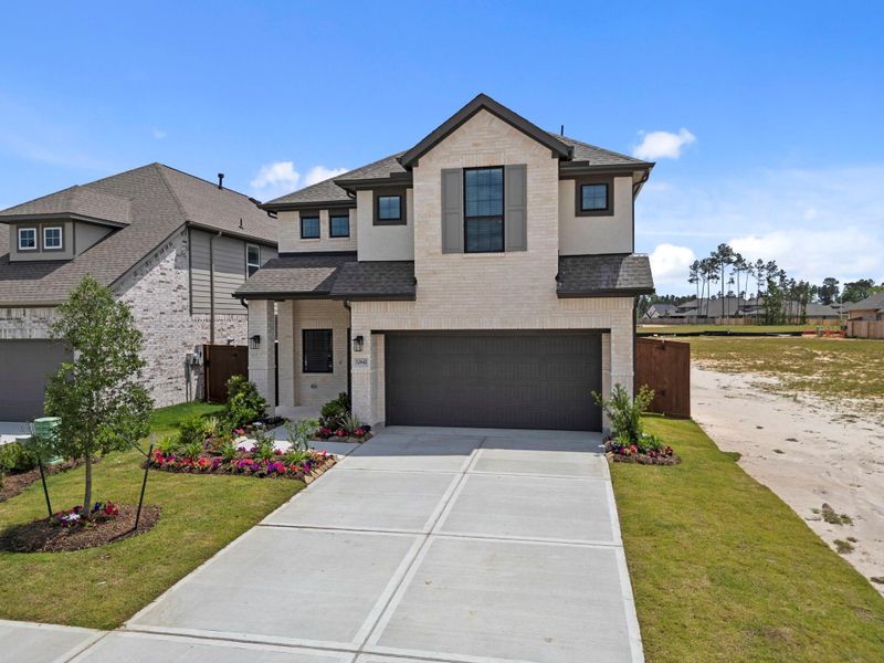 Front exterior of a new home in Evergreen, Conroe, TX, highlighting curb appeal (Image 17).