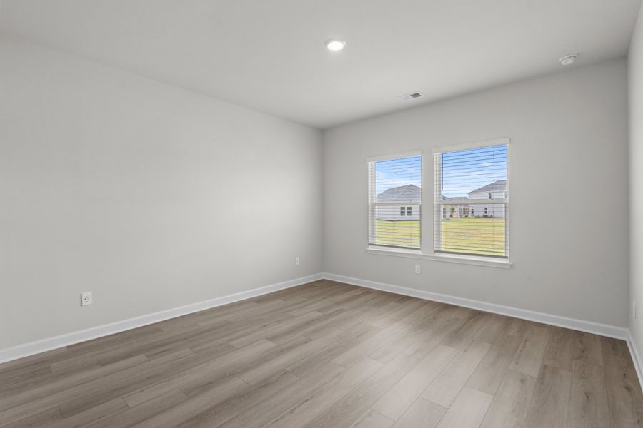 Spacious, unfurnished interior of a new home in Cypress Ridge - The Boardwalk Series, Longs (Image 21).