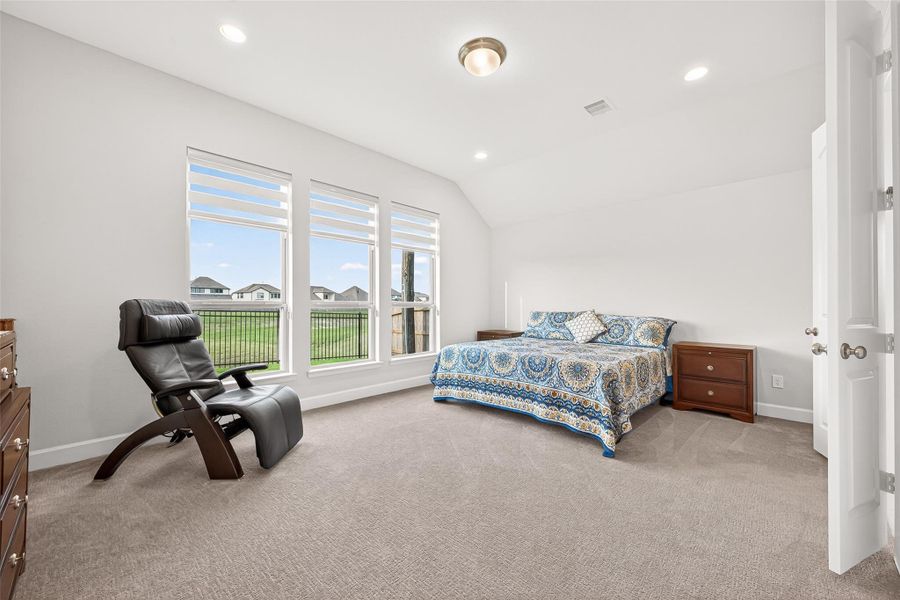 Spacious primary retreat offering exceptional comfort and privacy, enhanced by large windows that fill the room with abundant natural light. Elegant double doors lead to the luxurious en-suite bath, creating a true private sanctuary Spacious primary retreat offering exceptional comfort and privacy, enhanced by large windows that fill the room with abundant natural light. Elegant double doors lead to the luxurious en-suite bath, creating a true private sanctuary