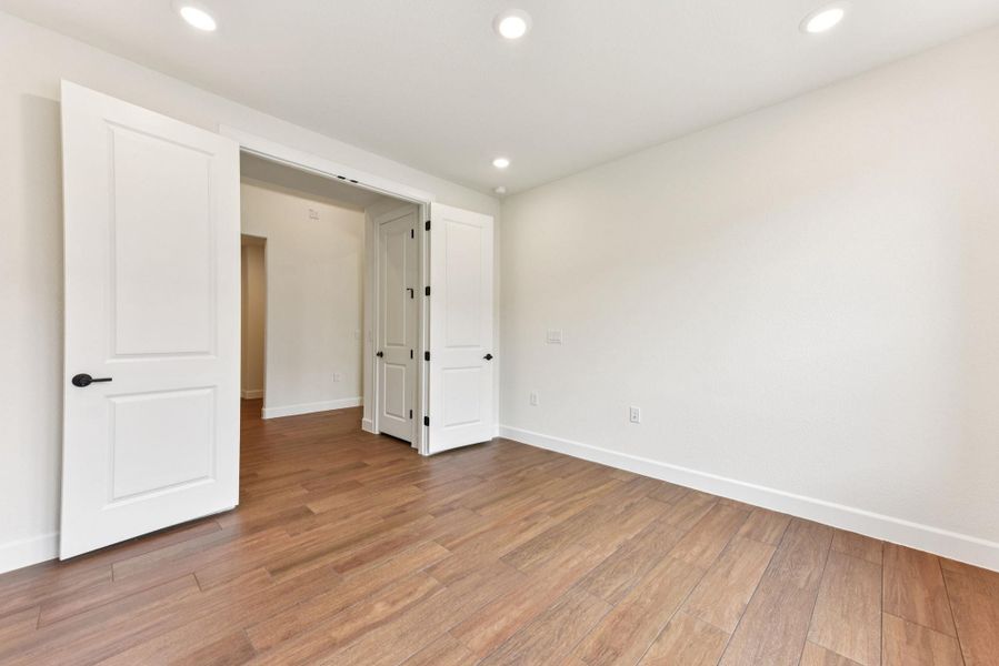 Unfurnished bedroom featuring light wood-style floors and recessed lighting